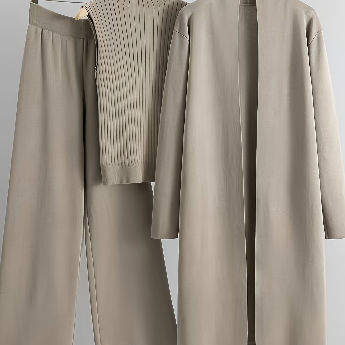 New High-Elasticity Autumn And Winter 2024 Women'S Loose Knit Set Featuring Long Wide-Leg Pants, a Shawl Cardigan, And a Turtleneck Sweater in a Stylish Three-Piece Ensemble.